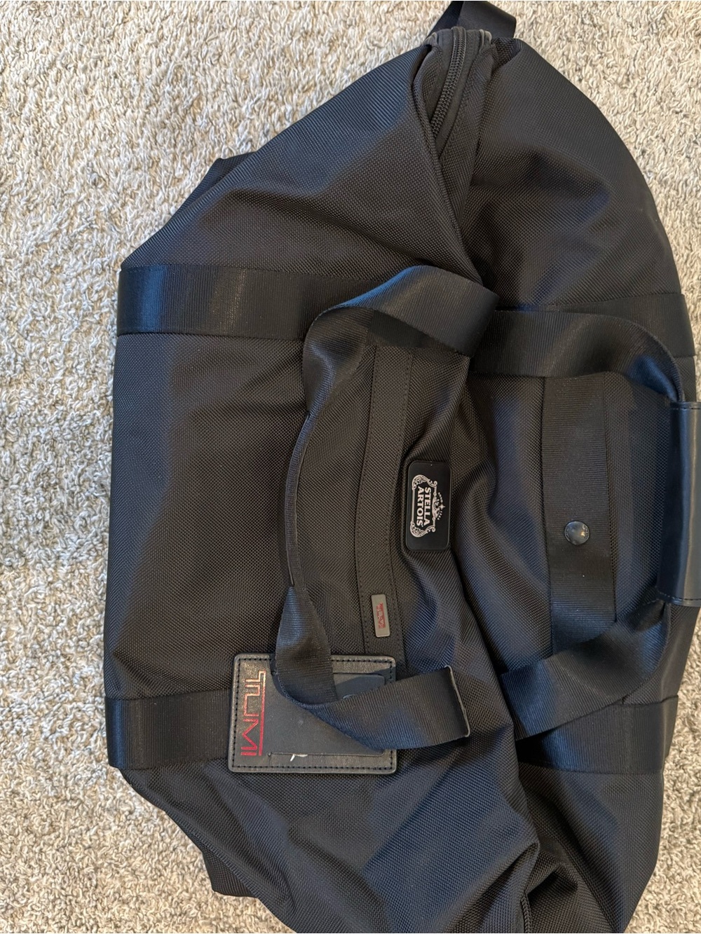 Tumi Black Travel Duffel with Red Logo Accent